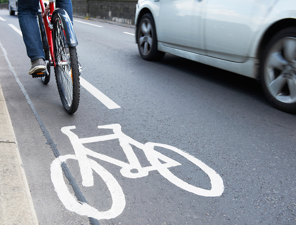 Image of person riding their bicycle in a cycle lane